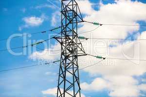 Electricity pylon against blue sky