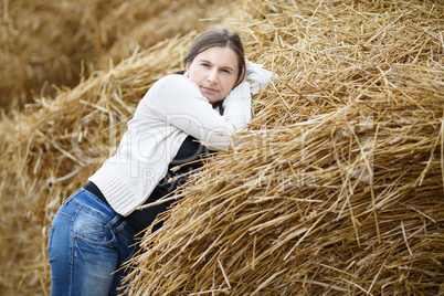 Woman on a straw background