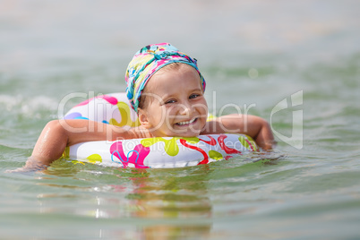Baby bathing in the sea