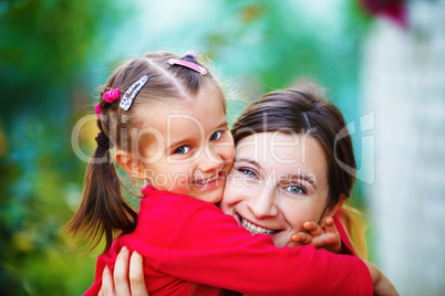 Embrace mom with daughter