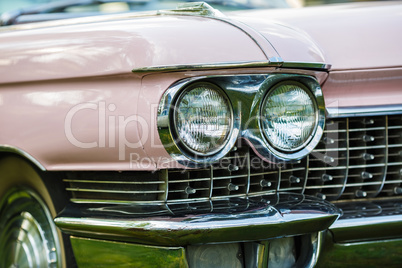 Headlight of pink vintage car