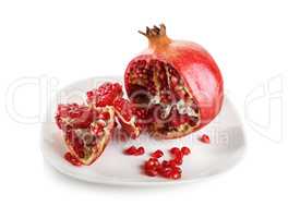 Pomegranate on a white plate.