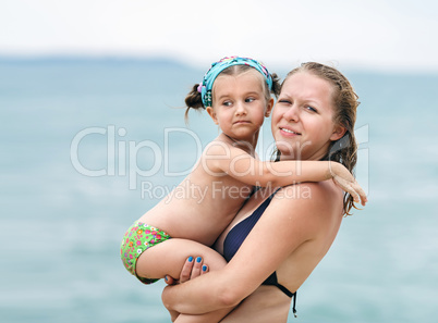 Mom holds little daughter