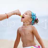 Baby eats on the beach