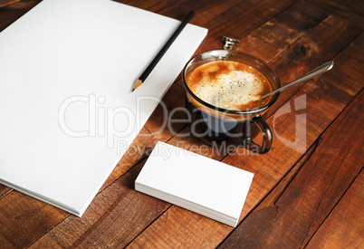 Blank letterhead, coffee cup and pencil