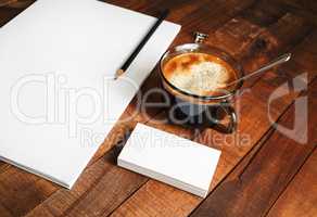 Blank letterhead, coffee cup and pencil