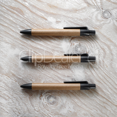 Three cardboard pens