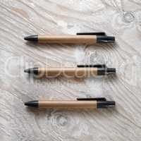 Three cardboard pens