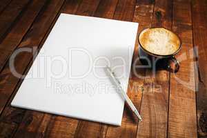 Letterhead, coffee cup and pen