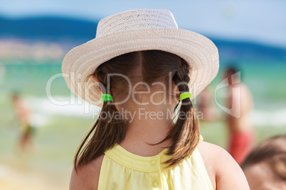 Child in a white hat