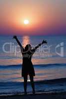 Girl stretches towards the sun