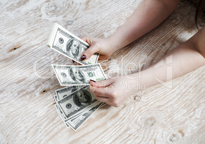 Hands with dollars