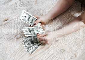 Hands with dollars