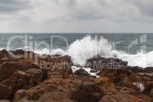 Storm wave and rocks