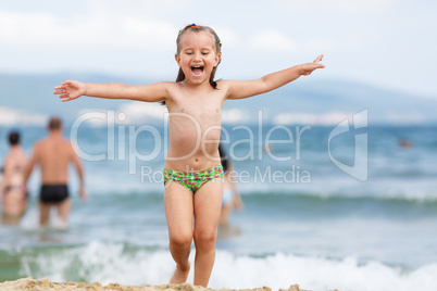 Laughing child on the beach