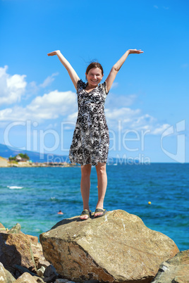 Woman with arms raised