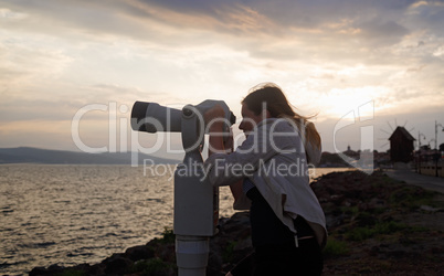 Woman using pay binocular