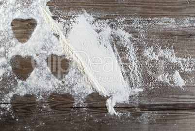 Flour on a wooden background