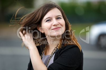 Woman straightens her hair