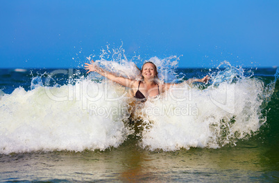 Woman in sea wave