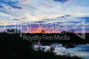 Colorful sunset and pond