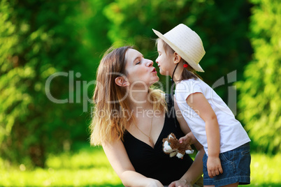 Mother kisses daughter