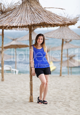 Woman with straw parasol