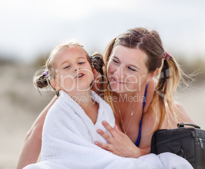 Mom and daughter on the beach
