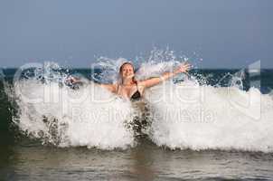 Girl in sea wave