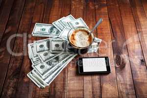 Coffee cup, money and phone