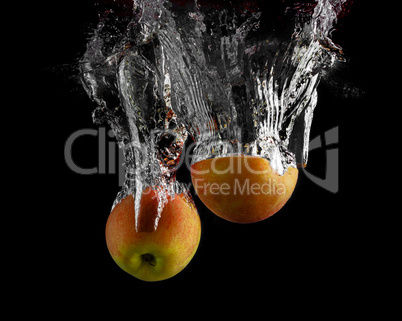 Apples falling into the water