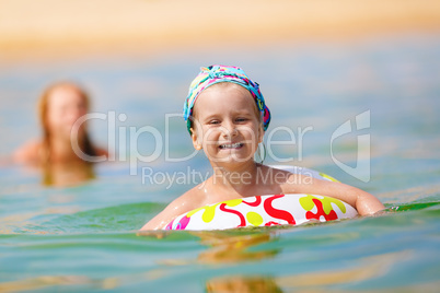 Child swims in the sea