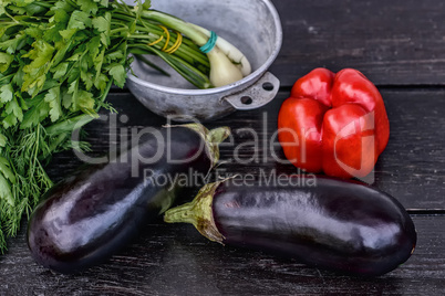 Set of fresh vegetables on dark wood table background. Still life photography.