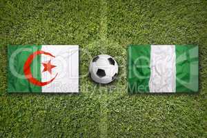 Algeria vs. Nigeria flags on soccer field