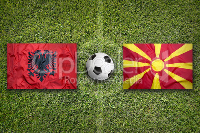 Albania vs. Macedonia flags on soccer field