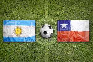 Brazil vs. Chile flags on soccer field