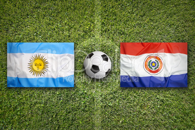 Brazil vs. Paraguay flags on soccer field