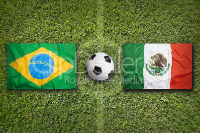 Brazil vs. Mexico flags on soccer field