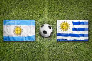 Brazil vs. Uruguay flags on soccer field