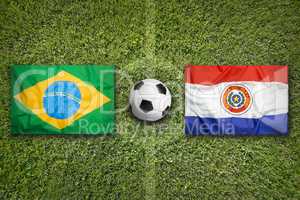 Brazil vs. Paraguay flags on soccer field