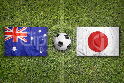 Australia vs. Japan flags on soccer field