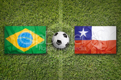 Brazil vs. Chile flags on soccer field