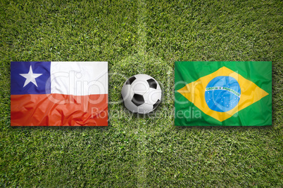 Chile vs. Brazil flags on soccer field