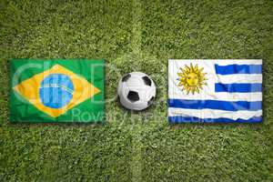 Brazil vs. Uruguay flags on soccer field