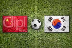 China vs. South Korea flags on soccer field