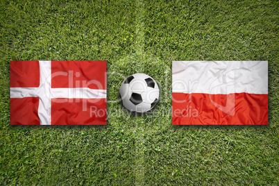 Denmark vs. Poland flags on soccer field