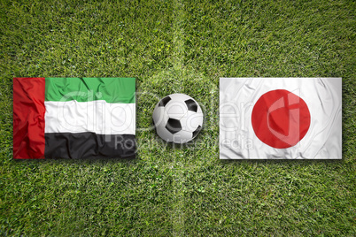 United Arab Emirates vs. Japan flags on soccer field
