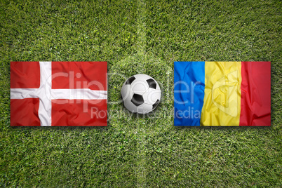 Denmark vs. Romania flags on soccer field