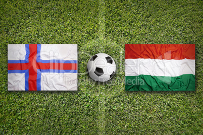 Faeroe Islands vs. Hungary flags on soccer field