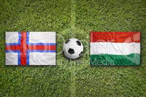 Faeroe Islands vs. Hungary flags on soccer field